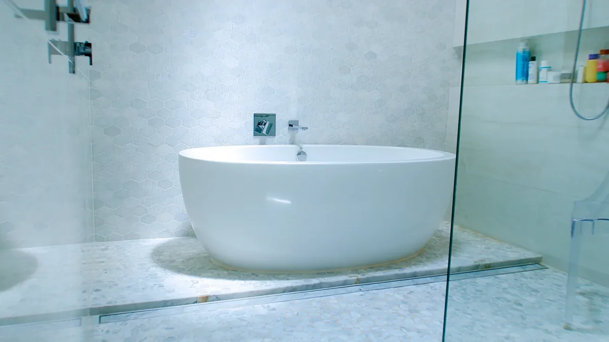 Bathroom remodeling for Trinity, FL homeowners: a Crego Contracting walk-in shower beside a soaking tub