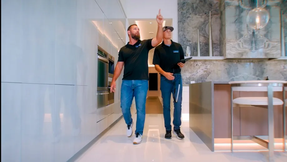Adam Crego walking through a customer’s home in Trinity, Florida