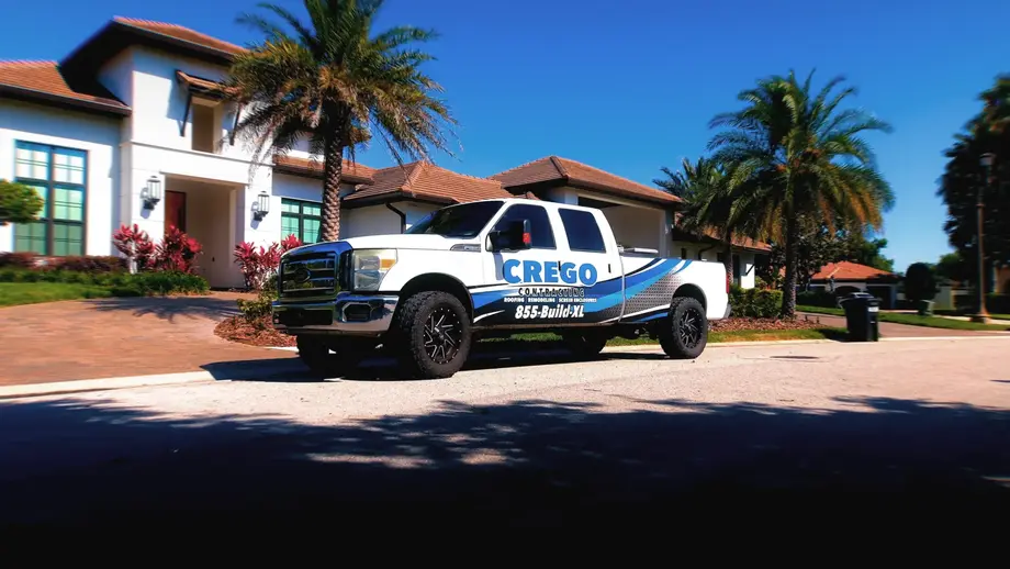 crego truck in front of a house